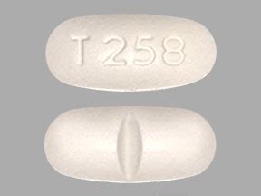 It works by blocking pain signals in the brain. . T258 white oval pill
